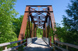 © Tanna - View of an old steel bridge over a stream in Maine.