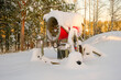A snow gun that sprays artificial ice crystals. Snow making machine. For the pleasure of skiers