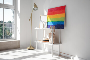 Poster - Interior of light room with shelving unit, rainbow painting and lamp