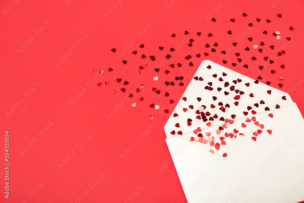 Envelope with hearts on red background. Valentine's Day celebration