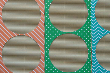 Poster - decorative paper stencils with circle shape cutouts on corrugated paper