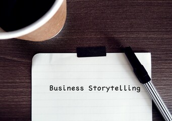 Pen on paper note with handwritten text - Business Storytelling - refers to stories which business communicate to connect with potential customers, partners and media, to stand out from competitors