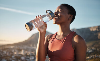black woman, runner and drinking water for outdoor exercise, training workout or marathon running re