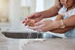 © Delcio F/peopleimages.com - Child, washing hands and learning about healthy lifestyle with clean water for health and wellness of body with mother at family home. Hand hygiene with woman and girl kid to clean dirt and bacteria