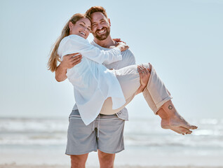 Love, beach and man carrying his wife while on romantic vacation, adventure or trip in Australia. Romance, happy and portrait of happy couple with a smile in nature by ocean while on seaside holiday.