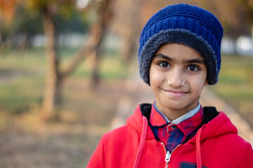 Wall Mural - portrait of a boy in a red coat