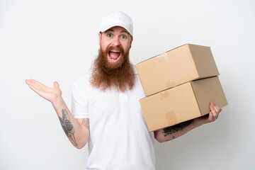 Wall Mural - Delivery reddish man isolated on white background with shocked facial expression