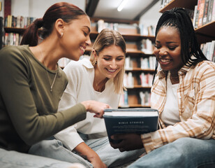 Wall Mural - Student, friends and book in school library for education, learning or knowledge together at university. Students smile for book club, books or information for research assignment or group project