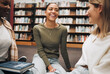 © Kay A/peopleimages.com - Student, friends and book discussion in library with smile for education, learning or knowledge at university. Group of happy women enjoy conversation, book club or social study for research project