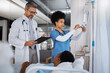 © K Davis/peopleimages.com - Doctor, nurse and patient in hospital, bed and clinic to check healthcare management, treatment and surgery. Surgeon writing medical notes, results and consulting nursing staff for iv drip medicine