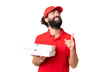 Wall Mural - Pizza delivery man with work uniform picking up pizza boxes over isolated chroma key background pointing up a great idea