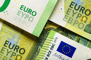 Wall Mural - Hundred Euro banknotes top view. European Union Currency.