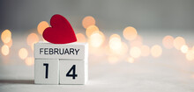 Small Red Heart On Wooden Calendar Blocks. Valentine's Day Background