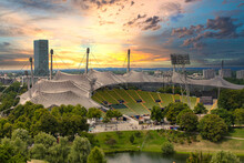View Of The Olympic Stadium In The Evening, Munich, Bavaria, Germany Outlook, Cloud, Cloudy, Foggy, Olympic Games, Sunshine, Overview, On, Look, Topview, European, Up, Town, City Park, Sunset