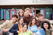 © Ivan - Group of university students resting in front of the library door