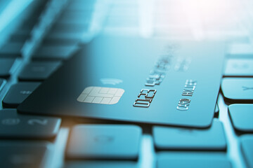 Aufkleber - Online banking concept with dark color credit card on blurred laptop keyboard background, closeup. 3D rendering