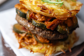 Sticker - Burger with vegetables and potato patty on table