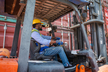 Poster - Foreman working at container stock yard with drive a loader forklift steering wheel control for transport handling.