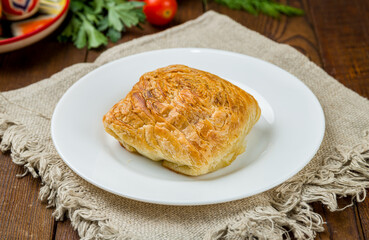 Wall Mural - Samsa national uzbek food on white plate on wooden table