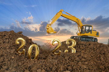 Concept Happy new year 2023,With Crawler excavator lift up bucket in construction site .On Sunset backgrounds