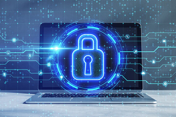 Poster - Close up of laptop on desktop with glowing circuit padlock sign on blurry background. Safety, secure and online prtection concept. Double exposure.
