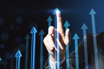 Poster - Business success and investing concept with man finger on digital touch screen with blue arrows growing up on abstract dark background