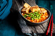 © Westend61 - Bowl of ready to eat vegan curry with edamame and tofu
