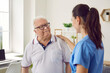 © Studio Romantic - Caring medical nurse comforting senior patient in office. Side view of female doctor caregiver wearing uniform supporting elderly man. Empathy, healthcare and support concept