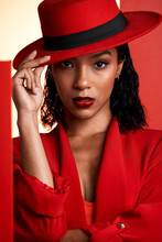 Face, Fashion And Black Woman In Red Hat, Suit And Stylish Clothing. Portrait, Beauty And Aesthetic Of Female Model From South Africa Posing With Makeup, Cosmetics Or Edgy, Classy And Designer Outfit