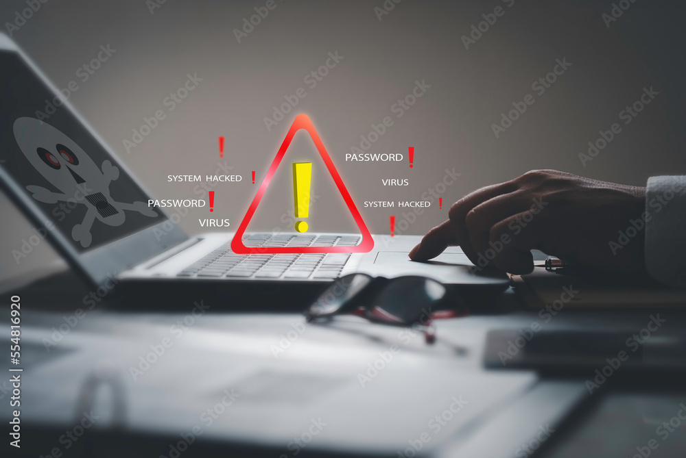 Businessman using computer laptop, System warning hacked alertsign for ...