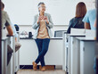 © David L/peopleimages.com - Classroom, presentation and science professor at university of physics or dna model in education, learning and teaching on whiteboard. Students in desk, teacher, leader or presenter woman in college