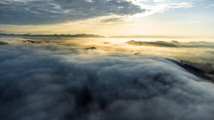 Poster - Aerial view of landscape Sunrise above clouds dramatic light