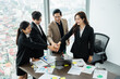© 1112000 - image of a group of Asian businessmen working together at the company