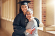 © D Lahoud/peopleimages.com - Graduation, university and portrait of mother with girl at academic ceremony, celebration and achievement. Family, education and mom hugging graduate daughter with degree or diploma on college campus