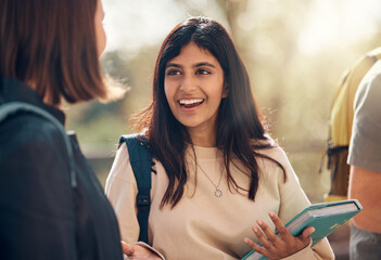 Canvas Print - Happy, university and woman student from India laughing and talking about a test. College, book and happy woman speaking to campus students about education, learning and school studying with a smile