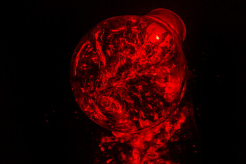 Christmas light bulb glows with red fire