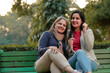 © PRASANNAPIX - Two indian woman sitting at park in winter wear
