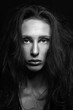 © Rytis - Fashion and make-up concept. Studio portrait of beautiful woman with eye shadows, long and dark dreadlocks hair looking at camera with seductive look. Studio shot black and white image