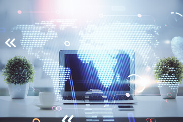Poster - Double exposure of desktop with computer and world map hologram. International data network concept.