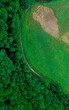 © Prodocdrone - A bird's-eye view of the edge of a field transitioning into a forest