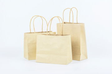  Blank brown paper bag on white background.