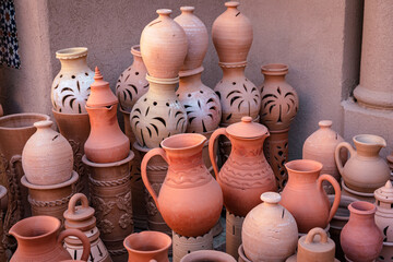 Wall Mural - Omani Souvenirs. Hand Made Pottery in Nizwa Market. Clay Jars at the Rural Traditional Arabic Bazaar, Oman. Arabian Peninsula. 