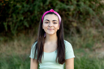 Canvas Print - Brunette young beautiful teenager girl outside enjoying a beautiful day