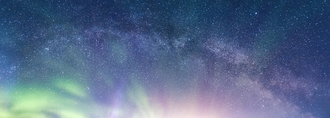 Wall Mural - beautiful aurora borealis with milky way glowing in the night sky on arctic circle
