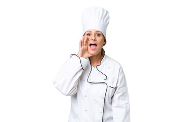 Canvas Print - Middle-aged chef woman over isolated background shouting with mouth wide open