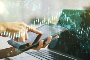 Poster - Multi exposure of abstract creative financial chart with world map and with finger presses on a digital tablet on background, research and analytics concept