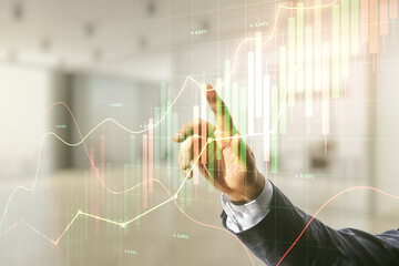 Poster - Man hand presses on abstract virtual financial graph on blurred office background, financial and trading concept. Multiexposure