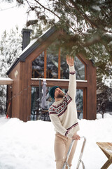 Wall Mural - Caucasian man decorating garden for Christmas time