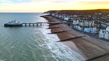 Eastbourne Town And  Pier At Sunset