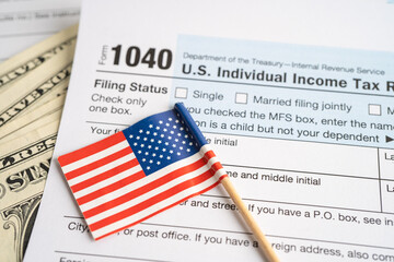 Wall Mural - Tax Return form 1040 with USA America flag and dollar banknote, U.S. Individual Income.
